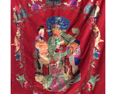 Chinese large embroidered red silk panel c19th century couch and satin stitch, large figures with painted faces. Scrolling bo