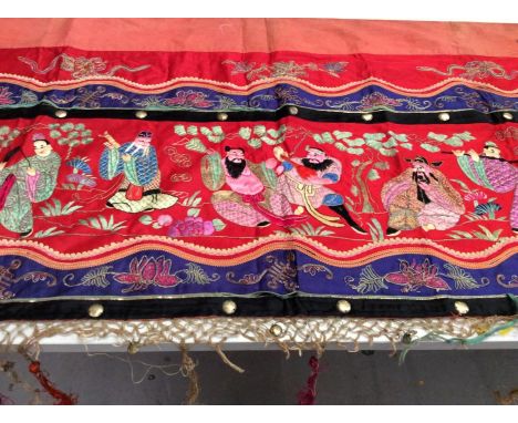 Chinese long embroidered red silk panel c19th century, couch and satin stitch musicians in garden scene etc. Embroidered silk
