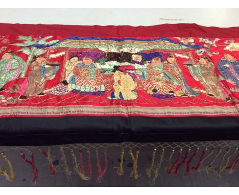 Chinese long embroidered red silk panel c1900s couch and satin stitch, figures with painted faces in garden scene with animal