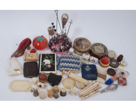 Collection of sewing items, pins, mother-of-pearl carving, carved bone items, needle cases, thimbles, tiny Stanhope souvenir 