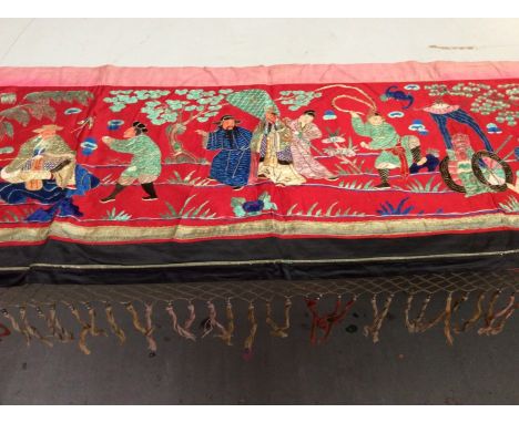 Chinese embroidered red silk panel c19th century, couch and satin stitch figures in garden scene with black silk border. Line