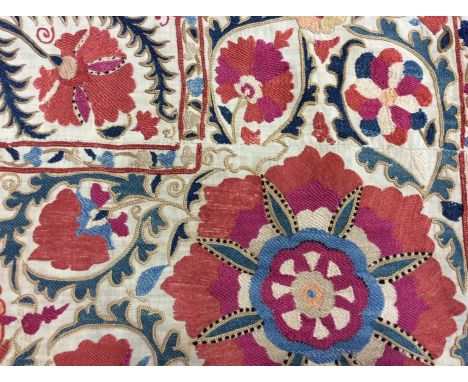 Antique / Vintage Turkish Suzani textile worked in panels and re-stitched together. Rectangular form with central motif. Silk