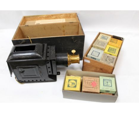 Cased Optimus magic lantern and a collection of antique glass slides, mostly boxed