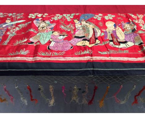 Chinese embroidered red silk panel c1900s couch and satin stitch figures in garden scene with black silk border. Lined with r