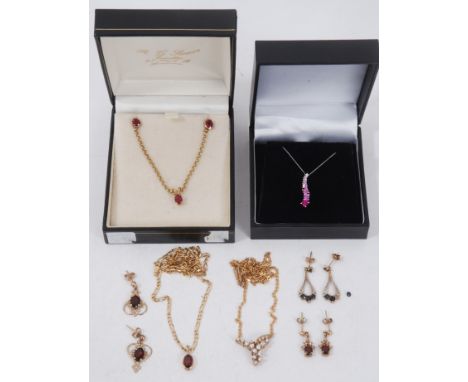 Group 9ct gold gem set jewellery including 9ct gold oval cut ruby pendant necklace and matching pair earrings, three other pa