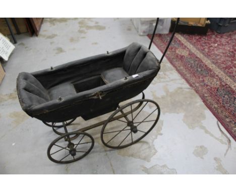 Victorian Children's double ended Dolls Pram of iron construction with ceramic handle