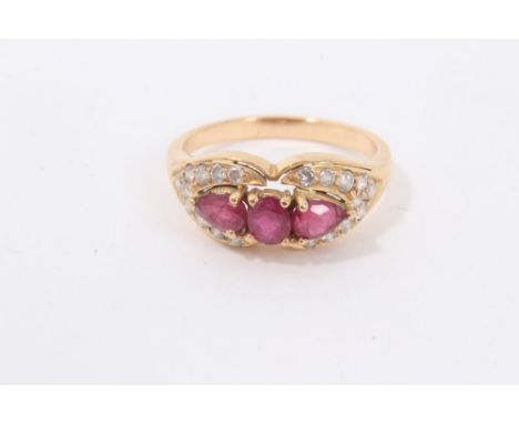 Ruby and diamond ring with three rubies surrounded by brilliant cut diamonds, ring size OCondition report: Shank is not marke