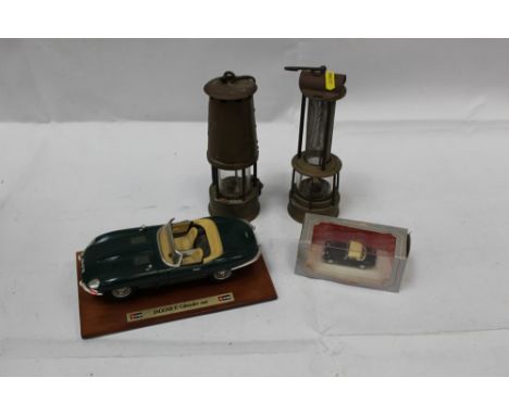 Brass Miners lamp by The Protector Lamp &amp; Lighting Co Ltd, together with another Miners lamp and two model cars