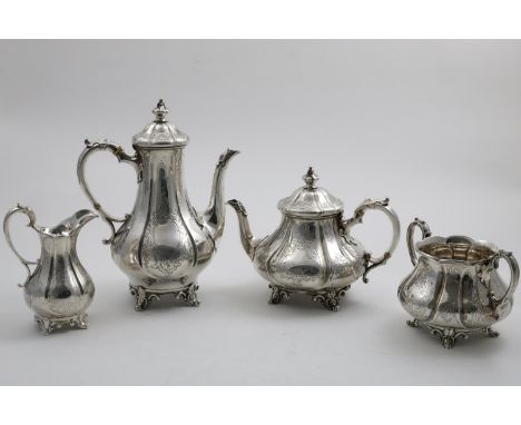 A VICTORIAN ENGRAVED FOUR-PIECE TEA &amp; COFFEE SERVICE with fluted baluster bodies, scroll feet and C-scroll handles, by Ed