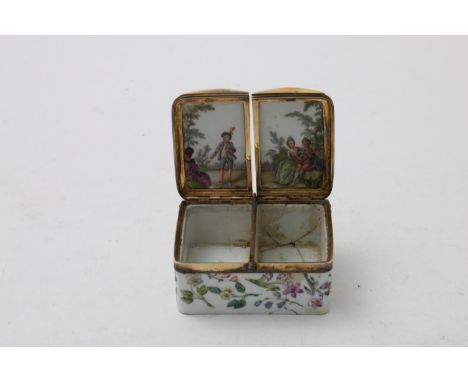 A CONTINENTAL PORCELAIN SNUFF BOX two compartments with hinged covers, the body painted with flowers and lovers on the interi