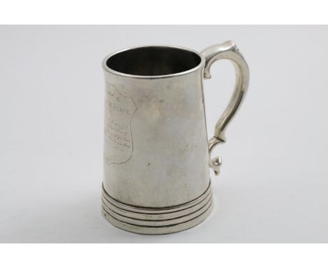 A 19TH CENTURY CHINESE MUG of tapering form with a reeded foot, a scroll handle and inset glass base, the front engraved with