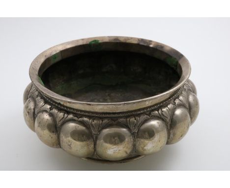 AN EARLY 19TH CENTURY DANISH BOWL  of squat circular form with lobed decoration around the sides below chased foliage, a bobb