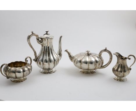 AN EARLY VICTORIAN FOUR-PIECE TEA &amp; COFFEE SERVICE of melon-fluted form on polyfoil bases, with S-scroll handles, the tea