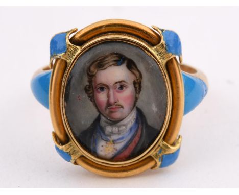 PRINCE ALBERT An early Victorian gold and pale blue enamelled ring, set with an enamel portrait of Prince Albert and a small 