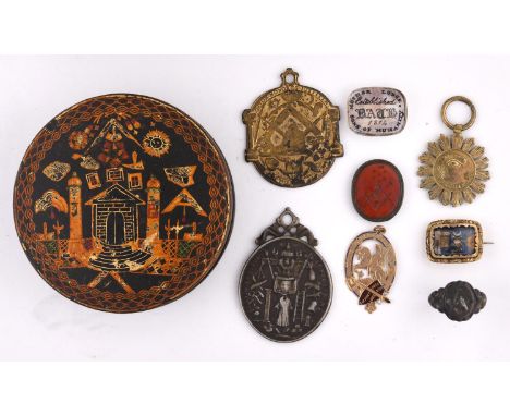 MASONIC A papier mache snuff box, painted with various emblems in gilt; 8.5 cms, early 19th century, together with a gold pen