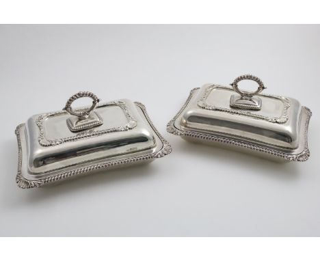 A PAIR OF EDWARDIAN CUSHION-SHAPED ENTREE DISHES &amp; COVERS rectangular with gadrooned borders, foliate shells in the corne