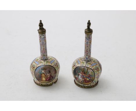 A PAIR OF ENAMEL FLASKS AND STOPPERS of bottle shape, the bodies each with three reserved medallions, probably Viennese, late