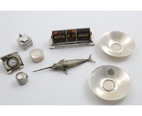 A MIXED LOT:- A mounted tortoiseshell desk calendar, two small Swedish dishes, a travelling timepiece with engine-turned cove