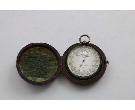 A VICTORIAN POCKET ANEROID BAROMETER resembling a pocket watch with engine-turned decoration on the back, signed "L. Casella"