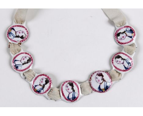 A SET OF SEVEN ENAMEL SLIDES Each with portrait, probably of Queen Caroline; approx. 2.5 cms