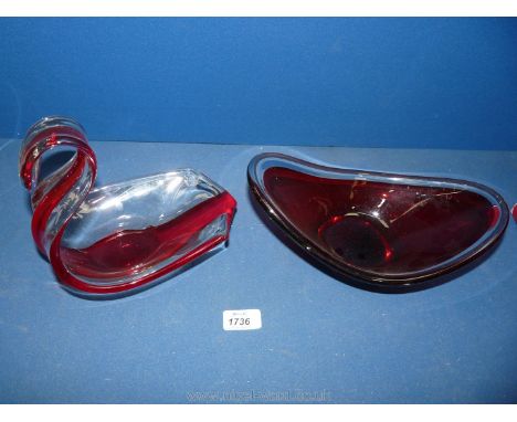 A Murano glass boat shape ruby and clear glass Bowl, 10 1/2" long mid 20th c. plus a similar swan shape Bowl, 8" long.