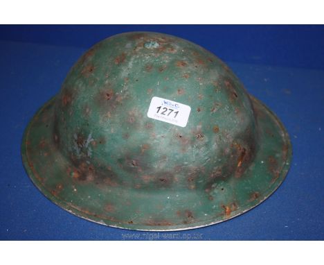 A 1938 steel Helmet with original inserts for head fitting adjustment.