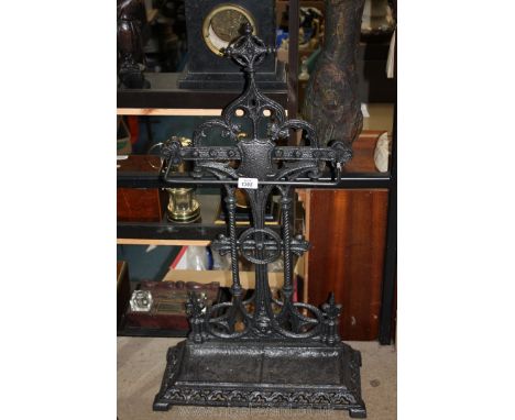 A cast iron stick/Umbrella stand with integral drip trays, 19 1/4'' wide x 34'' high approx.