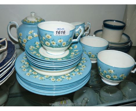 A pretty Crown Staffordshire vintage part Teaset with daisy decoration, turquoise band and comprising five cups, six saucers,