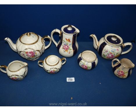 A Sadler teapot, milk jug and lidded sucrier together with a Sadler teapot, hot water jug, sugar bowl, etc.