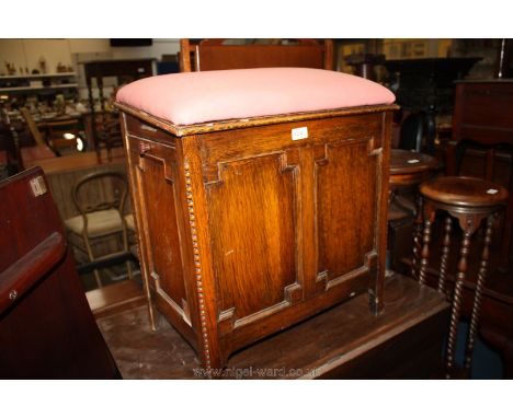 An unusual Oak double ended Purdonium Stool having pink upholstered seat cushion, 22'' x 14 1/4'' x 24'' high approx.