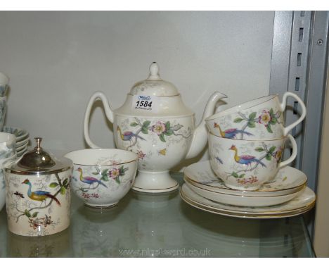 A Coalport afternoon Teaset for two comprising teapot, sugar bowl, jam pot, two cups, two saucers and two plates, bird of par