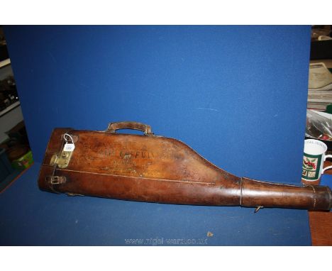 A vintage leg of mutton Shotgun Case, hard leather with carrying handle, brass lock and buckles, stamped 'Capt. Freeman, Beck