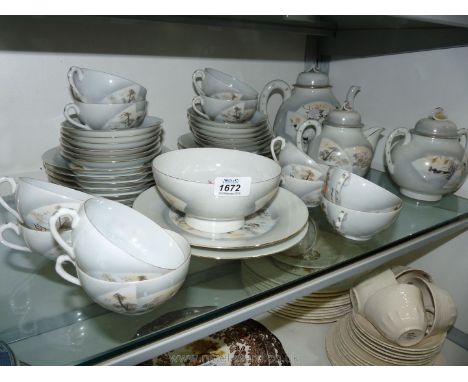 An oriental Teaset having teapot, sugar bowl, two handled lidded sucrier, tea cups, saucers and tea plates.