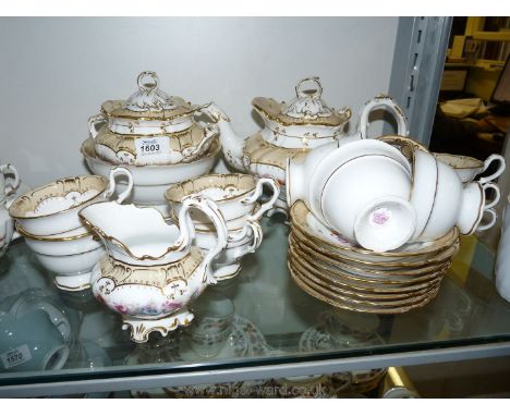 An early Victorian Teaset in the Rockingham style, white ground with floral pattern, each piece marked 2/7578, comprising cak