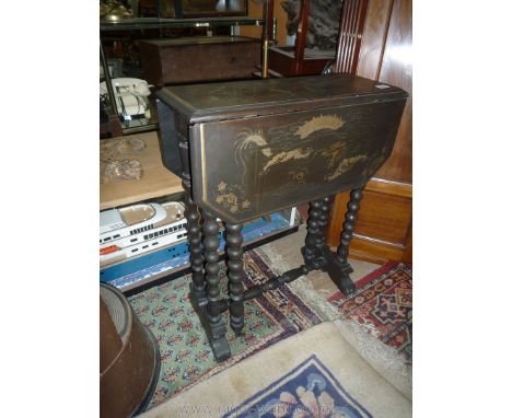 A lacquered Sutherland Table having bobbin turned legs, the top 22 3/8'' x 7 1/4'' extending to 25 5/8'' decorated with five 