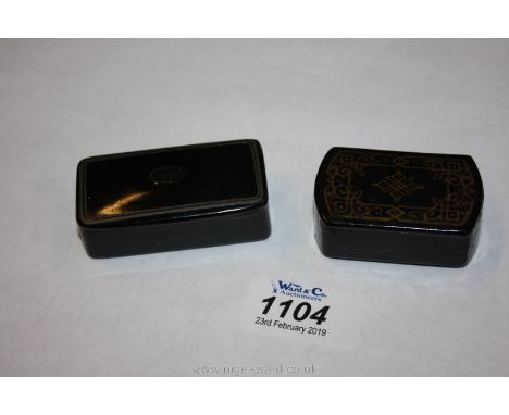 An interesting 19th c. papier-mache snuff Box with gilt decoration to lid, 2" long plus another snuffbox, 2 1/2" long also a 
