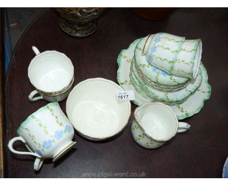 A pretty hand decorated part vintage Victoria china Teaset comprising six cups, saucers and plates, milk jug, sugar bowl and 