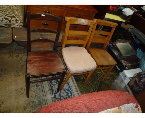 A pair of Beechwood framed Chapel Chairs having book troughs to the back and solid seats, one with beige cushion, and a ladde