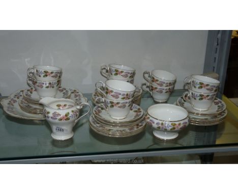 An Aynsley 'April Rose' Teaset comprising ten cups, eleven saucers, twelve tea plates, bread &amp; butter plate, sugar bowl, 