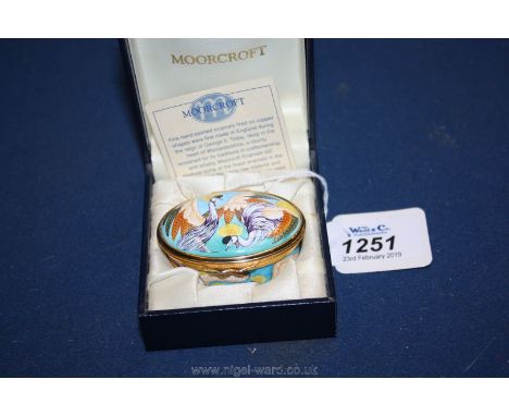A Moorcroft enamel Pill Box with crested cranes, boxed.