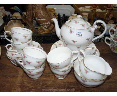 A quantity of vintage Teaware with pink rose pattern, various marks, including six cups, saucers, plates, sandwich/cake plate