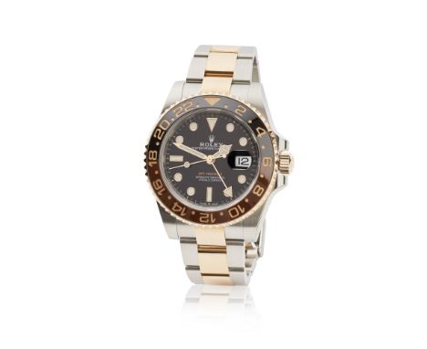 Rolex. A fine 18K rose gold and stainless steel automatic calendar bracelet watch with dual time zoneRolex. Belle montre brac