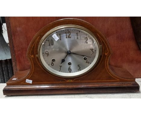 Edwardian mahogany inlaid hat shaped three train mantel clock, standing on brass bun feet. (B.P. 21% + VAT) 