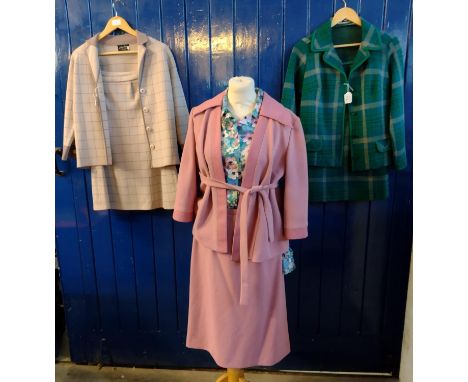 Three vintage jersey skirt suits, one in a pink colour by 'Falton, London' (size 16), together with a floral blouse by the sa