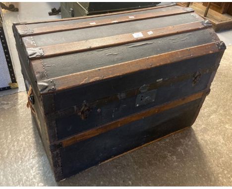 Early 20th century domed top canvas metal and wooded banded two handled steamer trunk marked with the initials 'G.M.'. (B.P. 