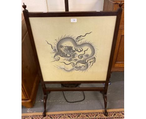 Early 20th century fire screen depicting silk panel of a Chinese dragon. (B.P. 21% + VAT)rips to the back panel.  