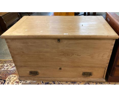 Late Victorian pine travelling trunk with metal hinges and fitted candle box, carrying handles above one long pullout drawer 