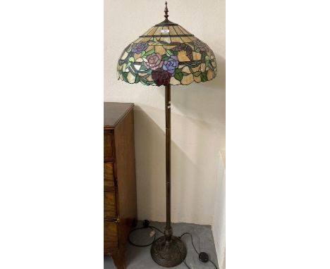 Modern Tiffany style standard lamp, the shade decorated with roses, butterflies and foliage and standing on a moulded base wi