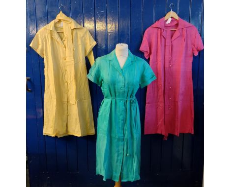 Three vintage 60's/70's brightly coloured silk and silky fabric shirt dresses with belts. (3)(B.P. 21% + VAT) 
