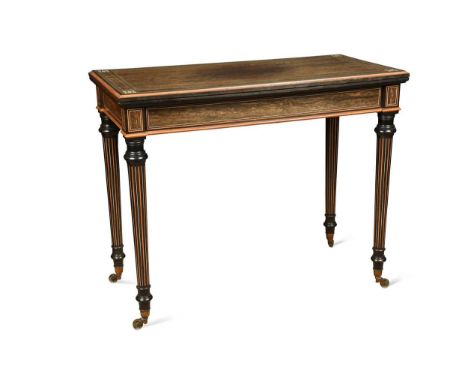 A coromandel and ebonised card table, 19th century, the top inlaid with ivory floral motifs to the corners and further ivory 